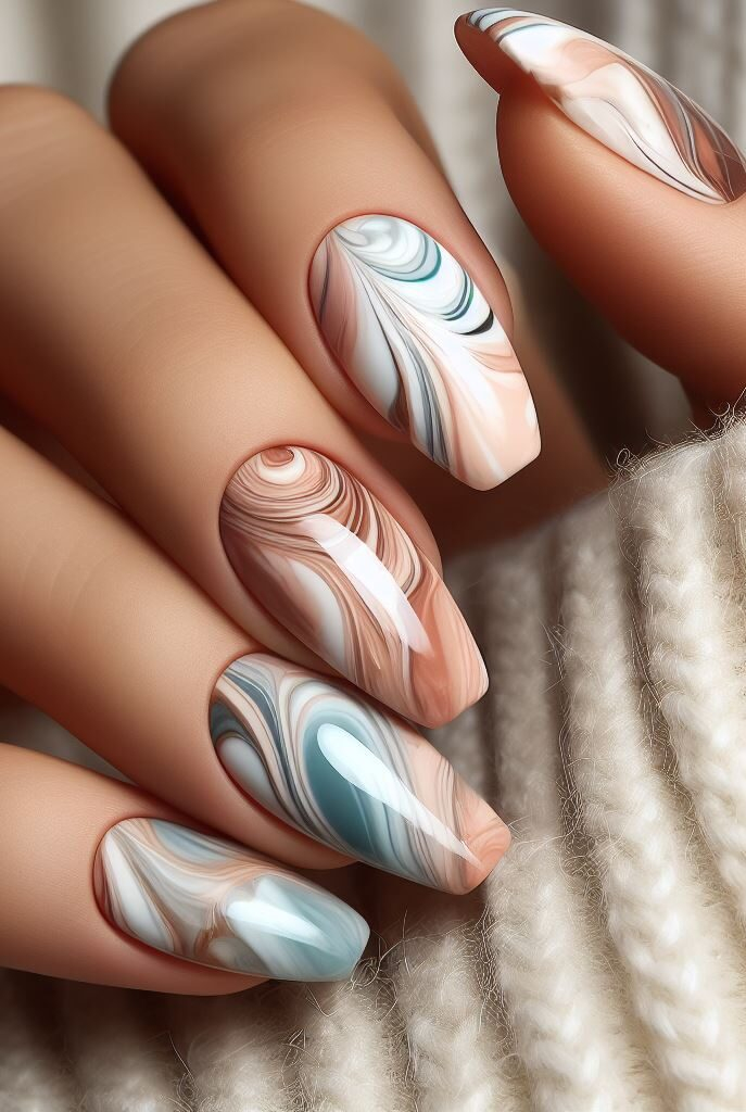 Jewel toned twist! Take your marble nails to the next level with a touch of luxury. Incorporate rich jewel tones like emerald green or sapphire blue for a truly captivating look.