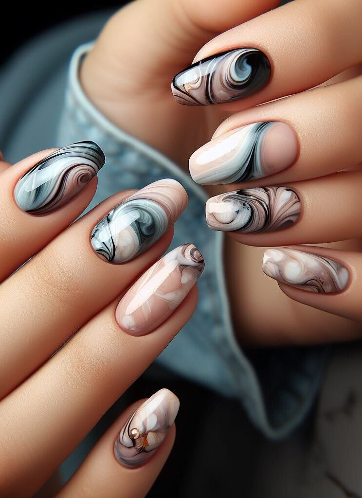 Minimalist marble! Less is more! Opt for sleek and subtle marble nail art with clean lines and muted colors for a sophisticated and modern twist.