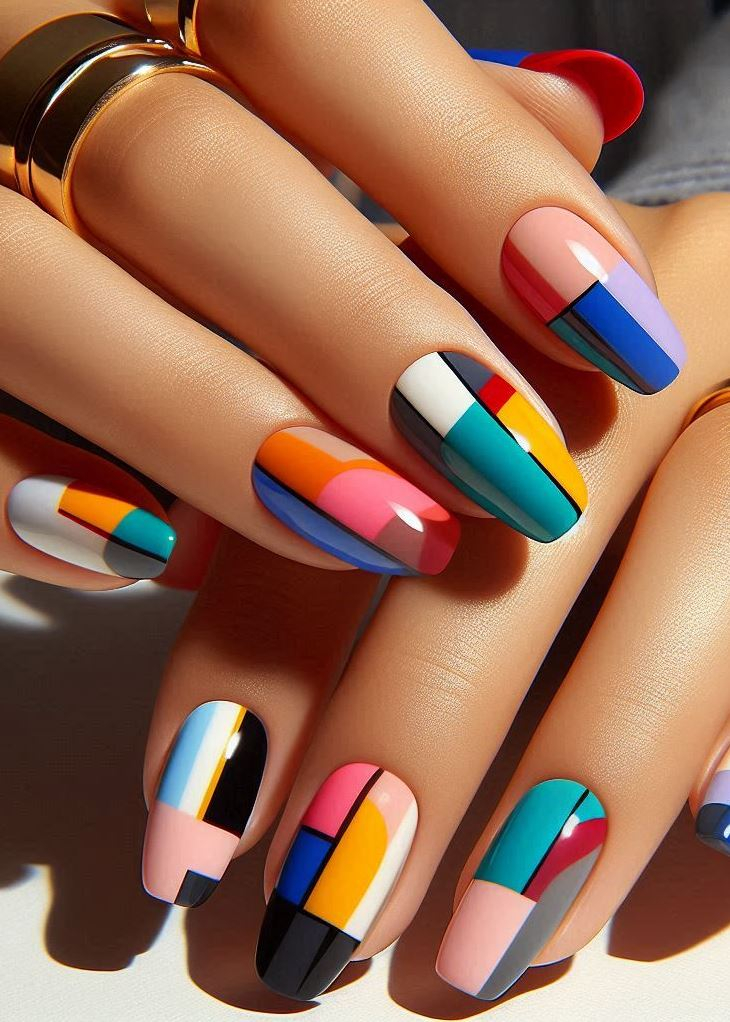 Abstract Nail Art: It's Not Just Random Splotches (We Promise!) | Pocoko Sunset Symphony: Color Blocking Nails with Gradient Flair Want to add a touch of dimension to your Color Blocking Nails? Try a gradient effect! Choose a range of colors within the same color family, and paint each nail a slightly different shade, creating a beautiful sunset-inspired look on your fingertips. It's a subtle way to add complexity to this bold nail art trend.